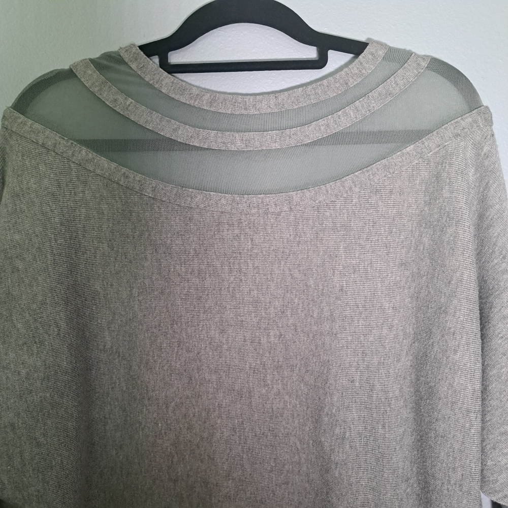 Moewy Grey, long sleeve knit top with cut outs at neckline. One size.